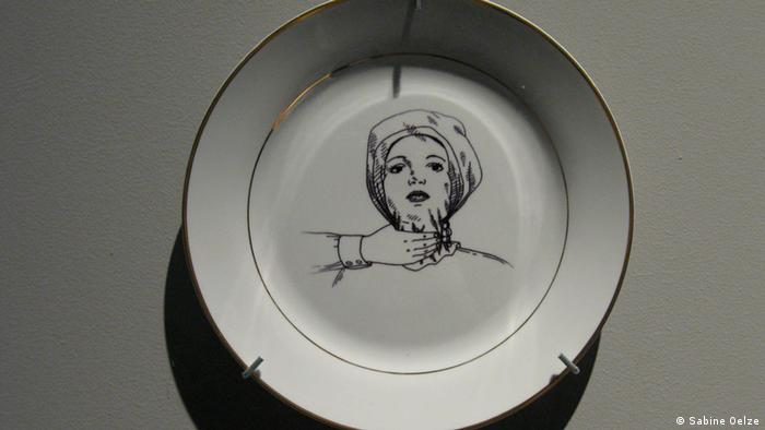 A drawing on a porcelain plate by Nikita Kadan