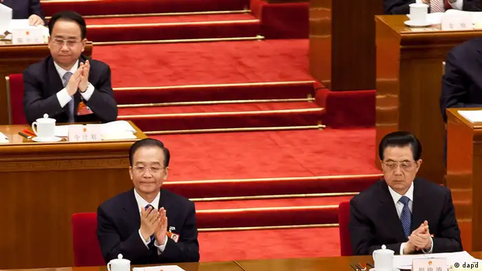 In this photo taken on March 11, 2012, Ling Jihua, a loyal aide and confidante to President Hu Jintao, top left, sits near Chinese President Hu Jintao, right, and Premier Wen Jiabao, left, as they attend a plenary session of the National People's Congress at the Great Hall of the People in Beijing. China’s hopes for a smooth, once-a-decade political transition have been shaken by a lurid new scandal involving the death of senior official Ling's son who crashed during what may have been sex games in a speeding Ferrari. (Foto:Andy Wong/AP/dapd)