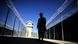 Barbed wire and a lone soldier protect an outdoor corridor of Afghanistan's Bagram Prison Photo: MASSOUD HOSSAINI/AFP/Getty Images Barbed wire and a lone soldier protect an outdoor corridor of Afghanistan's Bagram Prison Photo: MASSOUD HOSSAINI/AFP/Getty Images