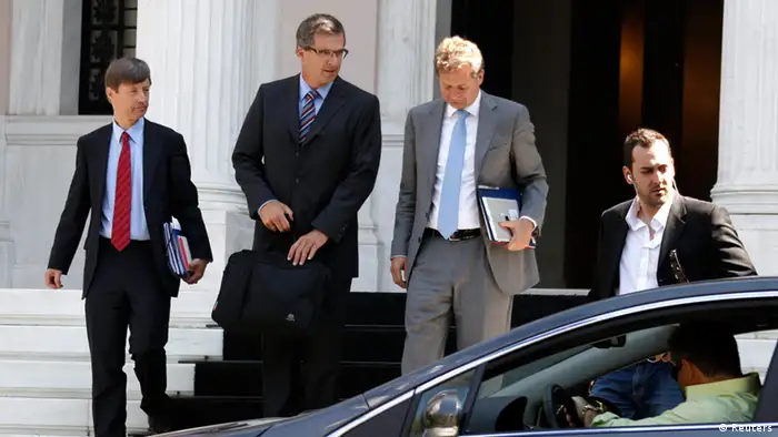 European Commission Director Matthias Mors (L), European Central Bank's (ECB) Klaus Masuch (2nd L) and International Monetary Fund's (IMF) Poul Thomsen (2nd R) leave the Greek Prime Minister's office in Athens September 10, 2012. Prime Minister Antonis Samaras sought on Monday to bridge differences with the country's lenders over a near 12-billion-euro austerity package, after they rejected parts of the plan that Athens hopes will unlock further aid payments. The troika of inspectors from the European Commission, the ECB and the IMF rejected unspecified aspects of the plan prepared by Samaras' government when talks between the two sides resumed Sunday. REUTERS/Yorgos Karahalis (GREECE - Tags: BUSINESS POLITICS)