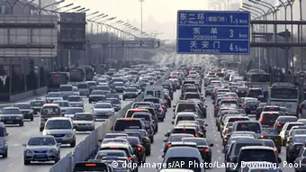 Vehicles are stuck in a traffic jam during weekday rush hour in Beijing Monday, Jan. 10, 2011.