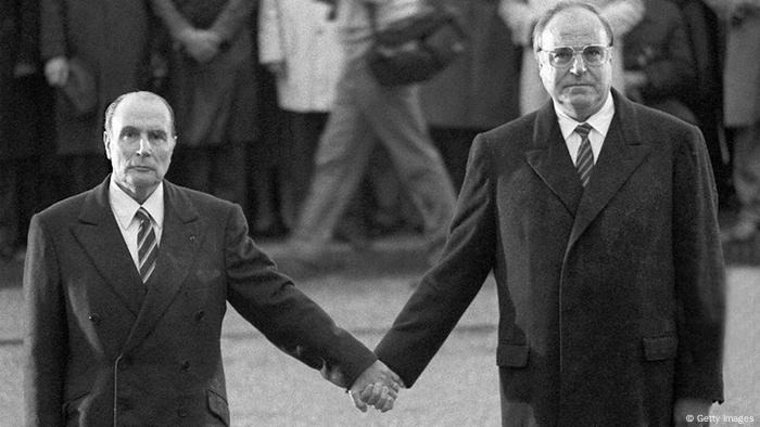 Verdun, FRANCE: (FILES) - Photo dated 22 September 1984 o a battlefield near Verdun, shows French President Francois Mitterrand (l) holding hands with German Chancellor Helmut Kohl, commemorating the deaths of French and German trops during two world wars. AFP PHOTO MARCEL MOCHET (Photo credit should read -/AFP/Getty Images)
