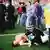 A man lies on the pitch during the chaos at Hillsborough in 1989