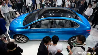 The Denza electric car -- a joint creation by Daimler and Chinese manufacturer BYD -- is unveiled at Auto China 2012 car show in Beijing on April 23, 2012. Beijing is hosting the Auto China 2012 exhiition in which top world carmakers will roll out a host of new models as they scramble for an edge amid sharply slowing sales in the planet's largest automobile market. The show runs until May 2. AFP PHOTO / Ed Jones (Photo credit should read Ed Jones/AFP/Getty Images)