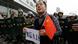 A protester holds a Chinese national flag and a paper bearing slogan as he stands in front of paramilitary policemen on the 81st anniversary of Japan's invasion of China, in Chengdu, Sichuan province, September 18, 2012. Hundreds of Japanese businesses and the country's embassy suspended services in China on Tuesday, expecting further escalation in violent protests over a territorial dispute between Asia's two biggest economies. Chinese characters on the paper read "Do not forget 9.18." REUTERS/Jason Lee (CHINA - Tags: POLITICS CIVIL UNREST ANNIVERSARY) A protester holds a Chinese national flag and a paper bearing slogan as he stands in front of paramilitary policemen on the 81st anniversary of Japan's invasion of China, in Chengdu, Sichuan province, September 18, 2012. Hundreds of Japanese businesses and the country's embassy suspended services in China on Tuesday, expecting further escalation in violent protests over a territorial dispute between Asia's two biggest economies. Chinese characters on the paper read "Do not forget 9.18." REUTERS/Jason Lee (CHINA - Tags: POLITICS CIVIL UNREST ANNIVERSARY)