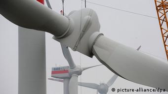 the propellor of a 5 megawatt turbine is hoisted into place Photo: Ingo Wagner dpa/lni