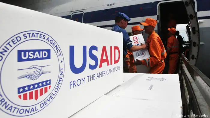 Kyrgyz Emergency Ministry workers unload the humanitarian aid from the United Stated over $2.7 million worth of medicines and medical supplies in Osh airport, southern Kyrgyzstan, 26 June 2010. EPA/MAXIM SHIPENKOV
