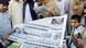 Afghan refugees reading newspaper reports next to a newspapers stall in Peshawar (Photo: dpa) Afghan refugees reading newspaper reports next to a newspapers stall in Peshawar (Photo: dpa)