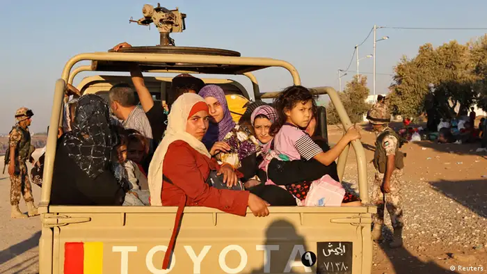 A Jordanian army car carrying Syrian refugees fleeing violence in their country after they crossed into Jordanian territory with their families from Syria into Jordan, near the town of Ramtha September 15, 2012. REUTERS/Muhammad Hamed (JORDAN - Tags: POLITICS CONFLICT SOCIETY IMMIGRATION)