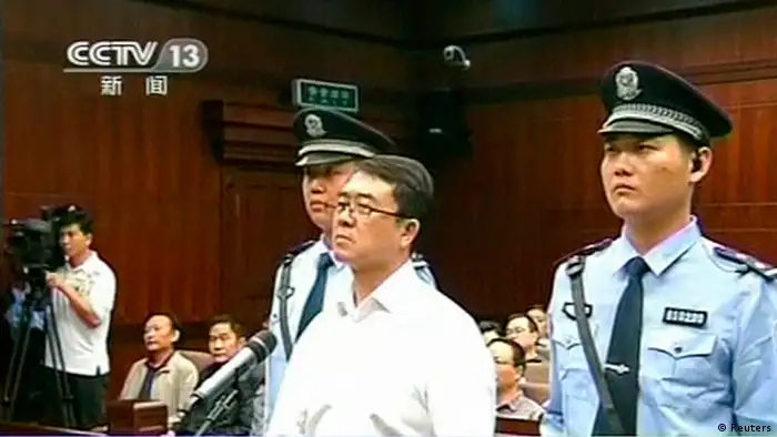 Chongqing municipality ex-police chief Wang Lijun (C) looks on during his sentencing inside the courtroom of the Chengdu People's Intermediate Court in Chengdu, Sichuan province in this still image taken from video September 24, 2012. Wang was found guilty on four charges, including seeking to conceal the murder of a British businessman Neil Heywood in a scandal that felled the ambitious politician Bo Xilai. REUTERS/CCTV via REUTERS TV (CHINA - Tags: CRIME LAW POLITICS) FOR EDITORIAL USE ONLY. NOT FOR SALE FOR MARKETING OR ADVERTISING CAMPAIGNS. CHINA OUT. NO COMMERCIAL OR EDITORIAL SALES IN CHINA