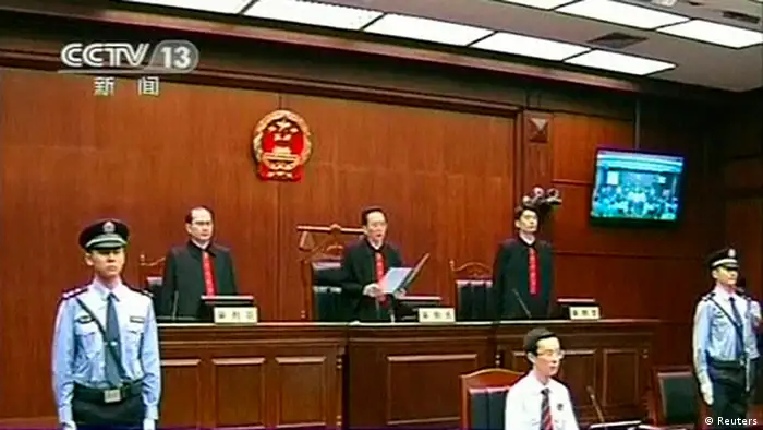 A judge (top, C) reads out the verdict during the sentencing of Chongqing municipality ex-police chief Wang Lijun (not pictured) inside the courtroom of the Chengdu People's Intermediate Court in Chengdu, Sichuan province in this still image taken from video September 24, 2012. Wang, sentenced to 15 years in jail, was found guilty on four charges, including seeking to conceal the murder of a British businessman Neil Heywood in a scandal that felled the ambitious politician Bo Xilai. REUTERS/CCTV via REUTERS TV (CHINA - Tags: CRIME LAW POLITICS) FOR EDITORIAL USE ONLY. NOT FOR SALE FOR MARKETING OR ADVERTISING CAMPAIGNS. CHINA OUT. NO COMMERCIAL OR EDITORIAL SALES IN CHINA