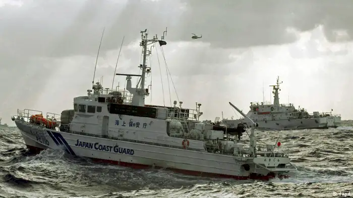 In this photo released by Taiwan's Central News Agency, a Japan Coast Guard patrol boat, front, comes in close proximity with a Taiwan Coast Guard patrol boat near the disputed islands called Senkaku in Japan and Diaoyu in China, in the East China Sea, Tuesday, Sept. 25, 2012. On Tuesday morning, about 50 Taiwanese fishing boats accompanied by 10 Taiwanese surveillance ships came within almost 20 kilometers (about 12 miles) of the disputed islands- within what Japan considers to be its territorial waters. (AP Photo/Central News Agency) TAIWAN OUT