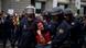 Police carrying a woman at a protest in Madrid Police carrying a woman at a protest in Madrid