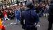 Protestors shout slogans as a riot policeman hides his nightstick during the demonstration at the parliament against austerity measures announced by the Spanish government in Madrid, Spain, Tuesday, Sept. 25, 2012. Spain's Parliament has taken on the appearance of a heavily guarded fortress with dozens of police blocking access from every possible angle, hours ahead of a protest against the conservative government's handling of the economic crisis. The demonstration, organized behind the slogan 'Occupy Congress,' is expected to draw thousands of people. It is due to start around 1730 GMT Tuesday. Madrid authorities said some 1,300 police would be deployed. The protestors call for Parliament to be dissolved and fresh elections held, claiming the government's austerity measures show the ruling Popular Party misled voters to get elected last November. (Foto:Andres Kudacki/AP/dapd) Protestors shout slogans as a riot policeman hides his nightstick during the demonstration at the parliament against austerity measures announced by the Spanish government in Madrid, Spain, Tuesday, Sept. 25, 2012. Spain's Parliament has taken on the appearance of a heavily guarded fortress with dozens of police blocking access from every possible angle, hours ahead of a protest against the conservative government's handling of the economic crisis. The demonstration, organized behind the slogan 'Occupy Congress,' is expected to draw thousands of people. It is due to start around 1730 GMT Tuesday. Madrid authorities said some 1,300 police would be deployed. The protestors call for Parliament to be dissolved and fresh elections held, claiming the government's austerity measures show the ruling Popular Party misled voters to get elected last November. (Foto:Andres Kudacki/AP/dapd)