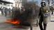 A molotov cocktail explodes beside riot police officers near Syntagma square in Athens (Photo: Reuters) A molotov cocktail explodes beside riot police officers near Syntagma square in Athens (Photo: Reuters)