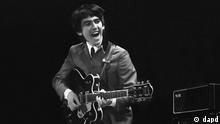 This February 11, 1964 photo provided by Christie's auction house, from a collection of photos of The Beatles shot by photographer Mike Mitchell at the Washington Coliseum in Washington, D.C., shows George Harrison during the group's first US concert, two days after their Ed Sullivan appearance. The concert photos, taken when the photographer was just 18 years old, will be auctioned by Christie's in their sale The Beatles Illuminated: The Discovered Works of Mike Mitchell, in New York on July 20, 2011. (Foto:Christie's, Mike Mitchell/AP/dapd)