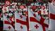 menschen mit Flagge von Georgien (Foto: (AP) menschen mit Flagge von Georgien (Foto: (AP)