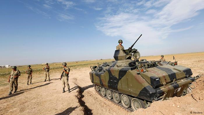 Turkish soldiers stand guard on the Turkish-Syrian border near the Akcakale border crossing. 
Photo: REUTERS/Murad Sezer