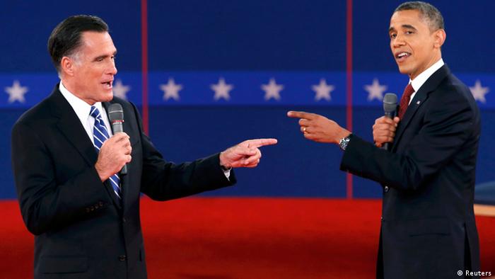 U.S. Republican presidential nominee Mitt Romney (L) and U.S. President Barack Obama gesture towards each other during the second U.S. presidential debate in Hempstead, New York, October 16, 2012. REUTERS/Mike Segar (UNITED STATES - Tags: POLITICS ELECTIONS USA PRESIDENTIAL ELECTION TPX IMAGES OF THE DAY)