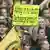 Dortmunder Fans halten ein Plakat mit der Aufschrift "Alltag ist nur durch Derbysiege erträglich" (Foto: Achim Scheidemann/dpa)