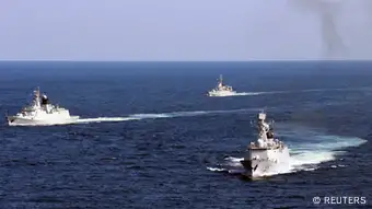 Vessels roam the waters of the East China Sea during a naval exercise, October 19, 2012. The Chinese navy conducted a joint exercise in the East China Sea with the country's fishery administration and marine surveillance agency on Friday. 11 vessels, eight planes and more than 1000 personnels took part in the drill, according to local reports. REUTERS/China Daily (CHINA - Tags: MILITARY) CHINA OUT. NO COMMERCIAL OR EDITORIAL SALES IN CHINA