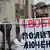 Одиночный пикет с плакатом "Свободу политзаключенным"