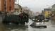 Half-submerged cars on a street in Albania Half-submerged cars on a street in Albania