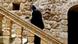 A priest climbs the stairs at the Mor Gabriel monastery in Turkey. (Photo credit should read TARIK TINAZAY/AFP/Getty Images) A priest climbs the stairs at the Mor Gabriel monastery in Turkey. (Photo credit should read TARIK TINAZAY/AFP/Getty Images)