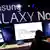 Menschen, die einen Galaxy Note II nutzen. Im Hintergrund groß der Schriftzug: Samsung Galaxy (Foto: Reuters)
