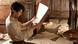 In the film Cloud Atlas, a man looks through old documents. (Photo: © Cloud Atlas Production GmbH) In the film Cloud Atlas, a man looks through old documents. (Photo: © Cloud Atlas Production GmbH)