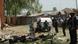 Soldiers stand guard on the side of a church which was targeted by a suicide attacker who detonated a car filled with explosives, in Kaduna, Nigeria, on October 28, 2012. The suicide bombing sparked fierce reprisals that saw a Christian mob burn a man alive in day of a bloody of violence that left at least 10 people dead and 145 wounded. Christian youths took to the streets of the northern city of Kaduna with machetes and sticks after the blast, targeting those they believed to be Muslims as anger again boiled over due to repeated church bombings in recent months. AFP PHOTO / STRINGER (Photo credit should read STRINGER/AFP/Getty Images) Soldiers stand guard on the side of a church which was targeted by a suicide attacker who detonated a car filled with explosives, in Kaduna, Nigeria, on October 28, 2012. The suicide bombing sparked fierce reprisals that saw a Christian mob burn a man alive in day of a bloody of violence that left at least 10 people dead and 145 wounded. Christian youths took to the streets of the northern city of Kaduna with machetes and sticks after the blast, targeting those they believed to be Muslims as anger again boiled over due to repeated church bombings in recent months. AFP PHOTO / STRINGER (Photo credit should read STRINGER/AFP/Getty Images)