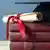 A diploma with a cap and mortarboard on a pile of books Photo: © Fotolia/Franny-Anne