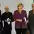 German Chancellor Angela Merkel (2nd R) International Monetary Fund (IMF) Managing Director Christine Lagarde (R) World Trade Organization (WTO) Director-General Pascal Lamy (3rd R) and Organisation for Economic Co-operation and Development (OECD) Secretary General Angel Gurria arrive for a news conference after talks at the Chancellery in Berlin, October 30, 2012. REUTERS/Thomas Peter (GERMANY - Tags: POLITICS BUSINESS)