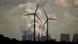 A wind farm in front of a traditional power station in Germany. (Photo: Oliver Berg) A wind farm in front of a traditional power station in Germany. (Photo: Oliver Berg)