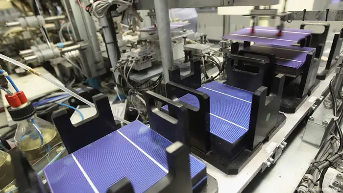 PRITZWALK, GERMANY - SEPTEMBER 12: Photovoltaic cells that will convert light from the sun into electricity and be assembled into solar panels go through a machine at the Aleo factory on September 12, 2012 in Pritzwalk, Germany. Aleo, which is owned by German engineering group Bosch, is fairing better than many of its competitors but a spokesman admitted the company is also suffering from the gradual reduction of the feed-in compenstation rates set by the German government, which gurantee fixed prices for electricity delivered into the German electricity grid. Several other solar industry firms in eastern Germany, including Q.Cells, Sovello and Solarwatt AG, have gone into bankruptcy this year. Aleo mainly produces solar panels installed on the roofs of residential houses. (Photo by Sean Gallup/Getty Images)