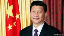 China Vice-President Xi Jinping stands during a trade agreement ceremony between the China and Ireland at Dublin Castle in Dublin, in this February 19, 2012 file photograph. China's ruling Communist Party unveiled its new leadership line-up on November 15, 2012 to steer the world's second-largest economy for the next five years, with Vice President Xi Jinping taking over from outgoing President Hu Jintao as party chief. Xi was also named head of the party's Central Military Commission, state news agency Xinhua said. REUTERS/David Moir/Files (IRELAND - Tags: POLITICS BUSINESS HEADSHOT)