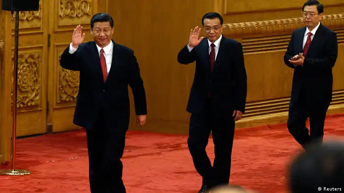 China's new Politburo Standing Committee members (from L to R) Xi Jinping, Li Keqiang and Zhang Dejiang wave as they arrive to meet with the press at the Great Hall of the People in Beijing, November 15, 2012. China's ruling Communist Party unveiled its new leadership line-up on Thursday to steer the world's second-largest economy for the next five years, with Vice President Xi Jinping taking over from outgoing President Hu Jintao as party chief. tREUTERS/Carlos Barria (CHINA - Tags: POLITICS)
