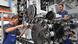 German mechanical engineer checking a tool German mechanical engineer checking a tool