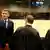 Ante Gotovina (L), who was commander in the Split district of the Croatian army, and Mladen Markac (R), a former Croatian police commander, talk with their lawyers in the courtroom of the Yugoslav war crimes tribunal (ICTY) prior to their appeal judgement in The Hague November 16, 2012. The appeals court overturned on Friday the conviction of Gotovina, the most senior Croatian military officer charged with war crimes during the Balkan conflict of the 1990s. Gotovina had been jailed for 24 years. The conviction of Markac, who had been serving an 18-year sentence, was also overturned. REUTERS/Bas Czerwinski/Pool (NETHERLANDS - Tags: CRIME LAW CONFLICT POLITICS)