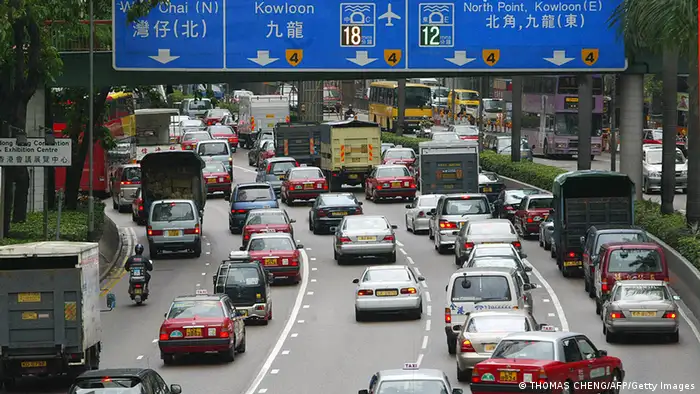 HONG KONG, CHINA: Vehicles are locked in a traffic jam on both sides of a multi-lane road leading to one of the cross-harbour tunnels in Hong Kong, 09 May 2005. Hong Kong came to gridlock for the first time 09 May as a toll on a major tunnel and heavy rains weighed on the Chinese territory's normally free-flowing transport system. AFP PHOTO/Thomas CHENG (Photo credit should read THOMAS CHENG/AFP/Getty Images)