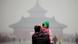 A young boy looks back while being carried by a man in front of the main hall of the 'Temple of Heaven' which is barely visible due to heavy smog in Beijing, China, 19 January 2012. The Beijing government said it will soon release stricter air pollution limits according to reports by local media, after citizens' complaints over heavy pollution which health authorities indicate lowers life expectancy by at least five years. EPA/DIEGO AZUBEL +++(c) dpa - Bildfunk+++ A young boy looks back while being carried by a man in front of the main hall of the 'Temple of Heaven' which is barely visible due to heavy smog in Beijing, China, 19 January 2012. The Beijing government said it will soon release stricter air pollution limits according to reports by local media, after citizens' complaints over heavy pollution which health authorities indicate lowers life expectancy by at least five years. EPA/DIEGO AZUBEL +++(c) dpa - Bildfunk+++