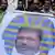 Morsi opponents hold a banner depicting the Egyptian president as a pharaoh, during a rally over Morsi decrees, in Garden City, Cairo, Egypt, 23 November 2012. Photo: EPA/ANDRE PAIN/epa03483533