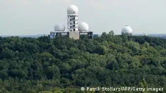 View of the main tower, topped by a radar dome of a former US National Security Agency (NSA)-run listening station on top of the Teufelsberg (German for Devil's Mountain) in western Berlin's Gruenewald forest taken on July 27, 2011, from Berlin's Glockenturm at the Olympic compound. The station, in operation from the late 1950's up until the reunification of Germany in 1990, was a vantage point for listening to Soviet, East German, and other Warsaw Pact nation’s military radio traffic. AFP PHOTO / PATRIK STOLLARZ (Photo credit should read PATRIK STOLLARZ/AFP/Getty Images)