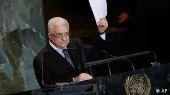 Palestinian President Mahmoud Abbas holds a letter requesting recognition of Palestine as a state as he addresses the 66th session of the United Nations General Assembly, Friday, Sept. 23, 2011 at UN Headquarters. (AP Photo/Mary Altaffer)