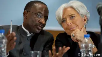 ABUJA, NIGERIA - DECEMBER 20: In this handout image provided by the International Monetary Fund (IMF), talks with Nigerian Central Bank Governor Sanusi Lamido Sanusi (L) during a joint press conference December 20, 2011 in Lagos, Nigeria. Lagarde is on her first trip to Africa as the Managing Director and will also visit Niger. (Photo by Stephen Jaffe/IMF via Getty Images)