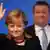 German Chancellor Angela Merkel waves as she arrives with CDU Secretary General Hermann Groehe to open a congress of their ruling conservative Christian Democratic Union (CDU) party on December 4, 2012 in Hanover, central Germany. Germany's Angela Merkel will rally the rank-and-file of her conservative party at its annual congress running until December 5, eyeing a third term as chancellor of Europe's top economy in elections in the year 2013. AFP HOTO / JOHANNES EISELE (Photo credit should read JOHANNES EISELE/AFP/Getty Images)