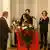 preisverleihung an Prof. Peter Bartl in albanien Prof. Peter Bartl wird nach dem Vortrag ein Blumenstraß überreicht Dezember 2012