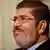 Egyptian President Mohammed Morsi is seen during a photo opportunity in his office at the presidential palace in Cairo, Egypt, Saturday, Dec. 8, 2012. Egypt's military said Saturday that serious dialogue is the "best and only" way to overcome the nation's deepening conflict over a disputed draft constitution hurriedly adopted by Islamist allies of President Mohammed Morsi, and recent decrees granting himself near-absolute powers.(Foto:Maya Alleruzzo/AP/dapd)