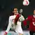 Konstantin Rausch (R) of Hanover and Manuel Friedrich of Leverkusen compete for the ball