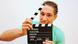 Young man holds a clapperboard, Copyright: Fotolia/westfotos.de Young man holds a clapperboard, Copyright: Fotolia/westfotos.de
